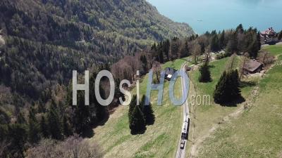 Typical Swiss Train In The Mountain - Video Drone Footage