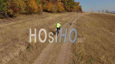 Cyclist Biking In The Outdoor Viewed From Drone