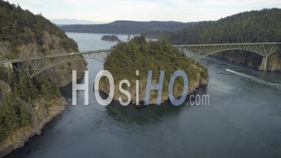 Ocean Boat Cruising Under Large Pacific Northwest Bridge With Cars Driving. Deception Pass Washington Usa - Video Drone Footage