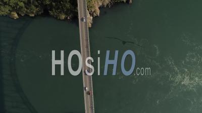 Birds Eye View Looking Down To Cars Driving Across Puget Sound Ocean Water On Big Deception Pass Bridge In Washington State - Video Drone Footage