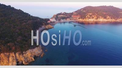 Aerial Shot Of Beautiful Sunset On The Calm Sea In Elba Island In Tuscany, Italy, 4k - Video Drone Footage