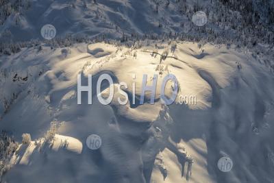 Dramatic Light On A Snow Covered Mountain Fraser Valley Bc - Aerial Photography