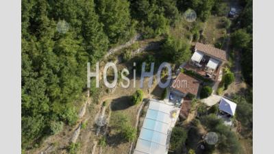 House And Swimming Pool In The Mountains - Aerial Photography