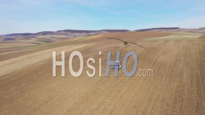 Video Drone Footage Of A Tractor Plowing The Field By Drone