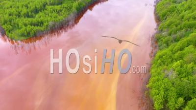 Drone View Of Waste Water From A Copper Mine Flooding Nature And Green Forest