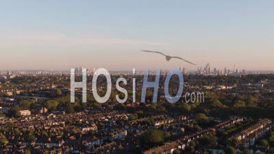 Aerial Dolly View Of A Typical Victorian Village (crouch End) And The Skyline Of The City Of London - Video Drone Footage