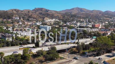 Aerial Video Drone Footage Of Southern California Beach Town Of Ventura, California With Freeway Foreground And Mountains Background