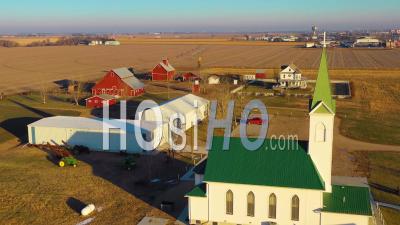 Aerial Video Drone Footage Over A Classic Beautiful Farmhouse Farm And Barns In Rural Midwest America, York, Nebraska
