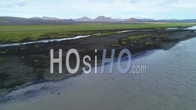Aerial View Of A Glacial River In A Remote Highland Region Of Iceland - Video Drone Footage
