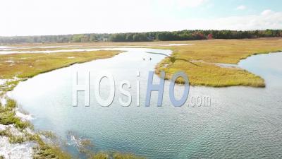 Aerial View Over Kayakers Rowing Through Vast Bogs Along The Nonesuch River Near Portland, Maine, New England - Video Drone Footage