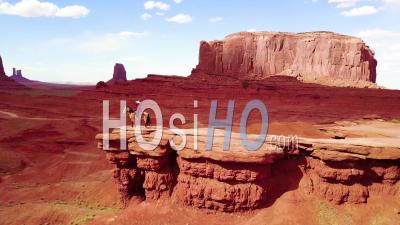 Aerial View Over A Cowboy On Horseback Overlooking Monument Valley, Utah - Video Drone Footage