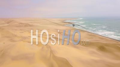 Aerial View Above A Road And Sand Dunes Near A Coastal Road On The Skeleton Coast Of Namibia - Video Drone Footage