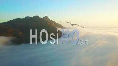 Aerial View Above The Clouds Looking At Table Mountain And Twelve Apostles Behind Cape Town, South Africa.