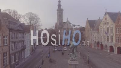 Aerial View Of A Mysterious Foggy Day Through A Central Square In Bruges, Belgium - Video Drone Footage