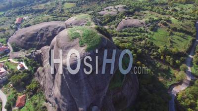 Aerial View Of Climbers Ascend A Sheer Rocky Cliff Face In Meteora, Greece - Video Drone Footage