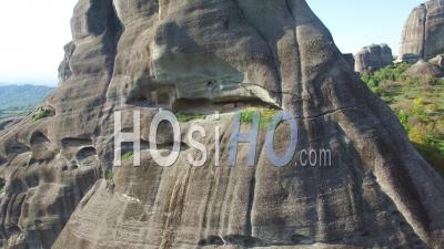 Aerial View Of Climbers Ascend A Sheer Rocky Cliff Face In Meteora, Greece - Video Drone Footage