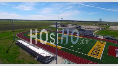 Aerial View Over A Modern High School Football Stadium In The Flatlands Of Texas Or Louisiana - Video Drone Footage