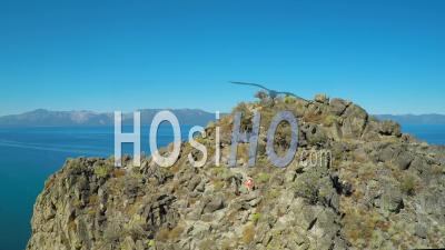 Aerial View Over A Hiker On A Mountaintop In Lake Tahoe, Nevada - Video Drone Footage