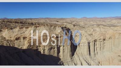 Aerial View Over A Beautiful Dry Cliff Face In The Remote Mojave Desert Of California Or Nevada - Video Drone Footage