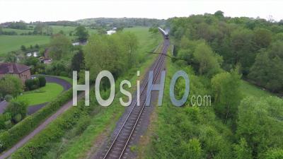 Aerial View Over The Orient Express Steam Train Passing Through The English Countryside - Video Drone Footage