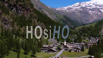 The Sky Resort Village Of Gressoney La Trinite In The Italian Alps, With Mount Rosa In The Background - Video Drone Footage