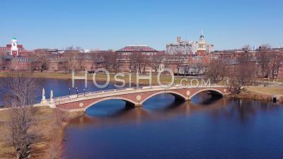 Aerial View Over The John W. Weeks Footbridge Reveals Harvard University Campus On The Charles River - Video Drone Footage