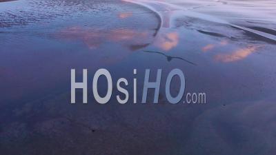 Aerial View Of Cloud Reflections In Tidal Bay And Sunset Patterns Near Rauoisandur Beach, Westfjords, Iceland - Video Drone Footage