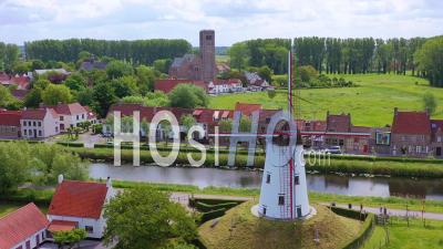 Aerial View Over Canal And Small Town Of Damme, Belgium And Historic Windmill - Video Drone Footage