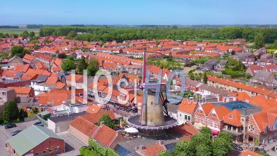 Aerial View Over Classic Dutch Holland Town With Prominent Windmill, Sluis, Netherlands - Video Drone Footage