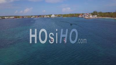 Aerial View Over Paddleboarders Off The Coast Of Honduras, Central America - Video Drone Footage