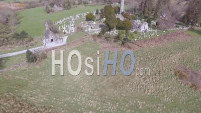 Aerial View Over The Glendalough Cemetery In Ireland With Graves And Visitors - Video Drone Footage