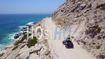 Aerial View Of An Atv Speeding On A Dirt Road Near Cabo, Baja Mexico - Video Drone Footage