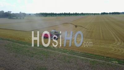 Combine-Harvester In A Wheat Field - Video Drone Footage