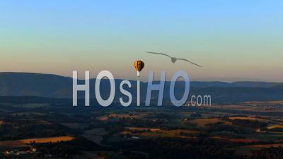 Balloon Flying Over Provence Fields, In The Grazing Light Of Summer - Video Drone Footage