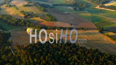 Balloon Flying Over Provence Fields, In The Grazing Light Of Summer - Video Drone Footage