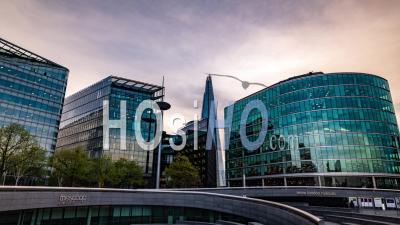 Office Buildings In London At Sunset With Clouds Reflections On Glass