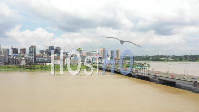 Abidjan City And The Bridge Houphouet Boigny Leading To Abidjan Plateau - Video Drone Footage