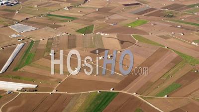 Aerial View Of (wide Shot) Patchwork Fields, Brown And Green