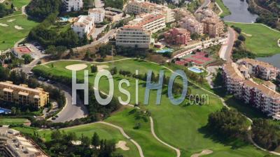 Aerial View Of (wide Shot) Golf Course And Apartment Complexes