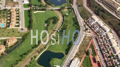 Aerial View Of (wide Shot) Golf Course And Apartment Complexes