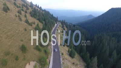 Car Driving On A Mountain Road - Video Drone Footage