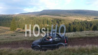 Off-Road Car Driving On A Mountain Dirt Road - Video Drone Footage