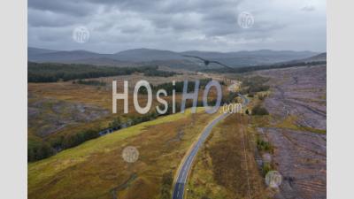 Empty Road In The Northwest Highlands Of Scotland At Autumn - Aerial Photography