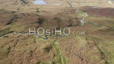 Aerial View Over Winding River In The Northwest Highlands Of Scotland