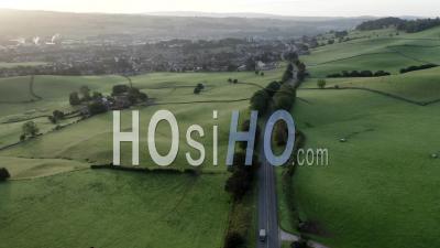 Rural Road Across Farming Fields At Sunrise - Video Drone Footage