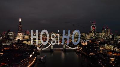 City Of London Skyline And Tower Bridge In London, At Night - Video Drone Footage