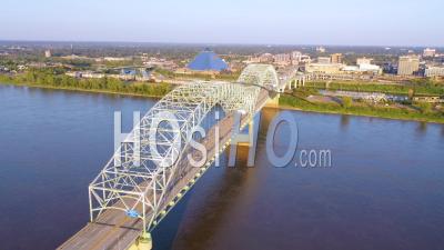 Memphis Tennessee Across The Mississippi River With Hernando De Soto Bridge Foreground And Memphis Pyramid Background - Aerial Video By Drone
