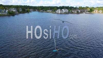 Kite Boarder Near Luxury Homes, Real Estate And Mansions On Ross R Barnett Reservoir Near Old Trace Park, Jackson, Mississippi - Aerial Video By Drone