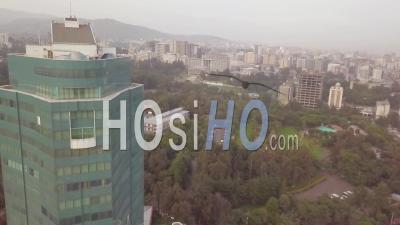 Foggy Aerial Past Office Building Skyscraper In Downtown Business District In Tblisi, Republic Of Georgia - Video Drone Footage