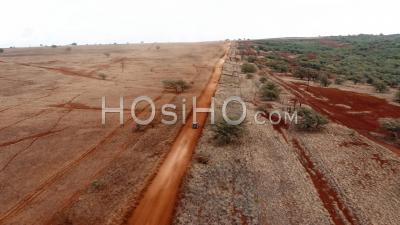 Cars Traveling On A Generic Rural Dirt Road On Molokai, Hawaii From Maunaloa To Hale O Lono - Aerial Video By Drone